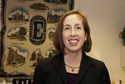 elizabeth mccloud in her office with etown quilt in back