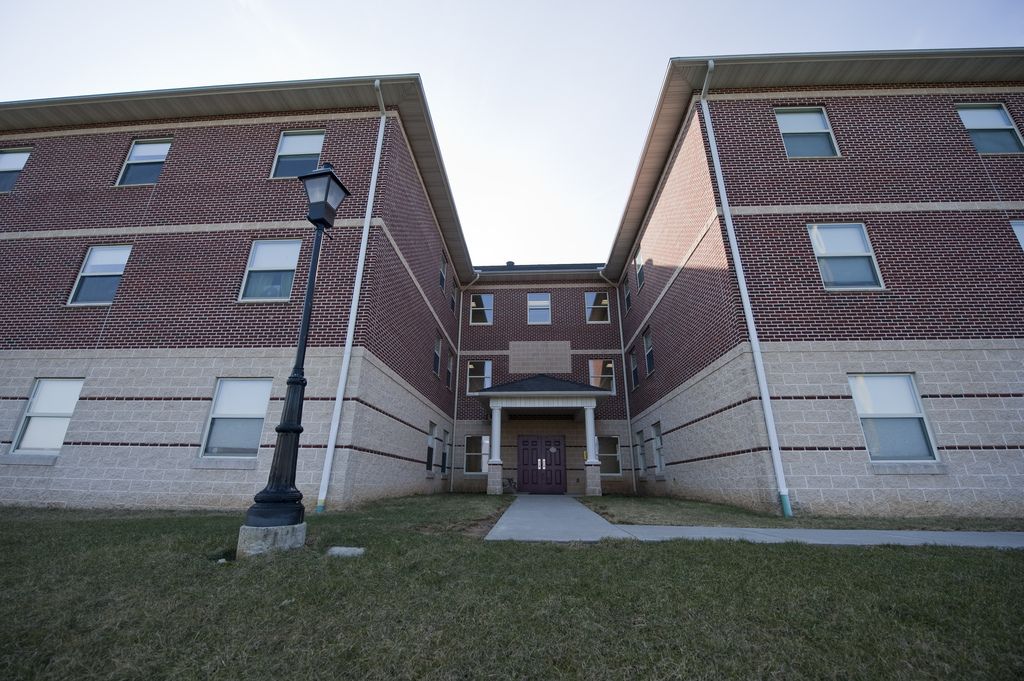 hackman apartments exterior brick three story building