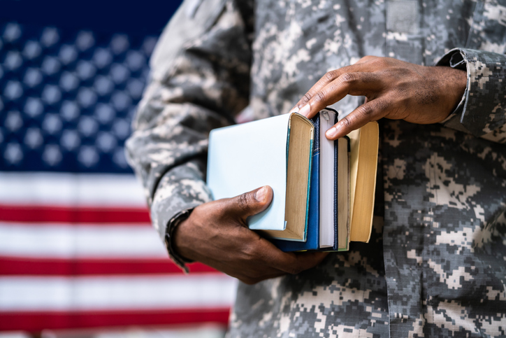 Soldier in front of the flag