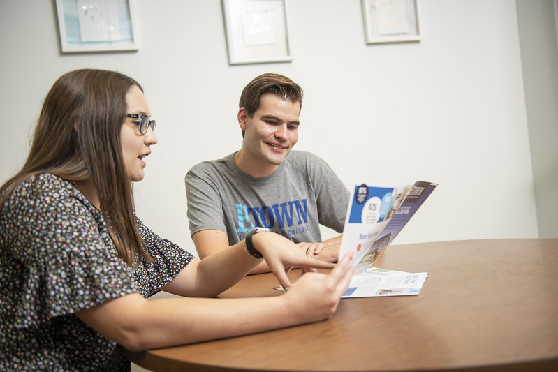 student working with counselor