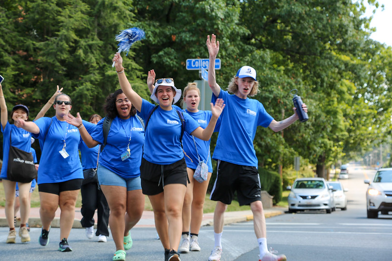 students walking up street