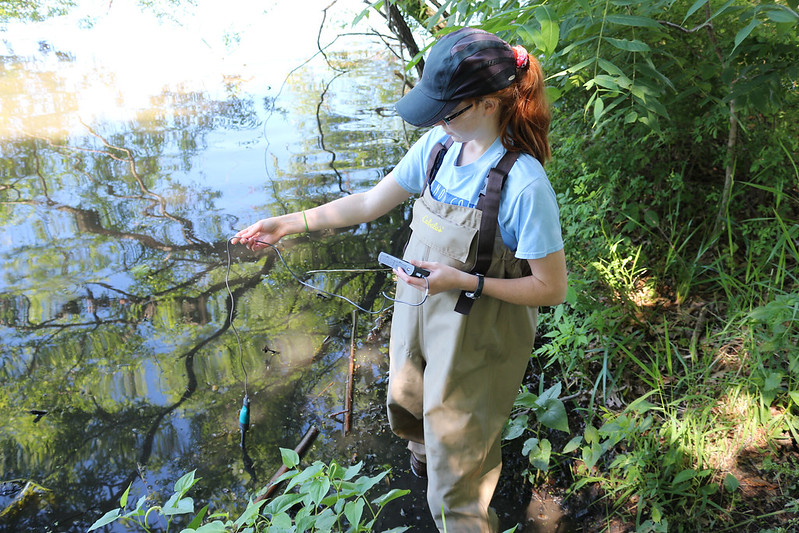 student in lake testing