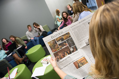 student reading newspaper