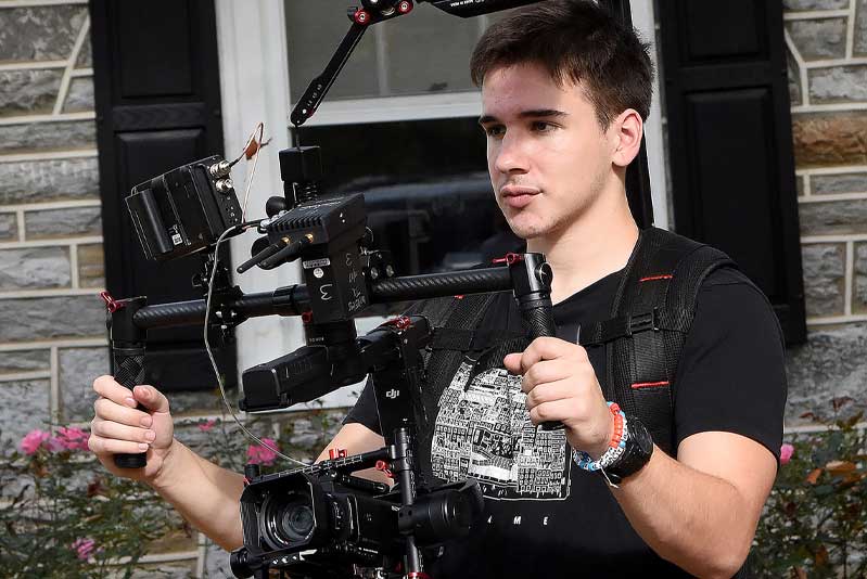 student with camera