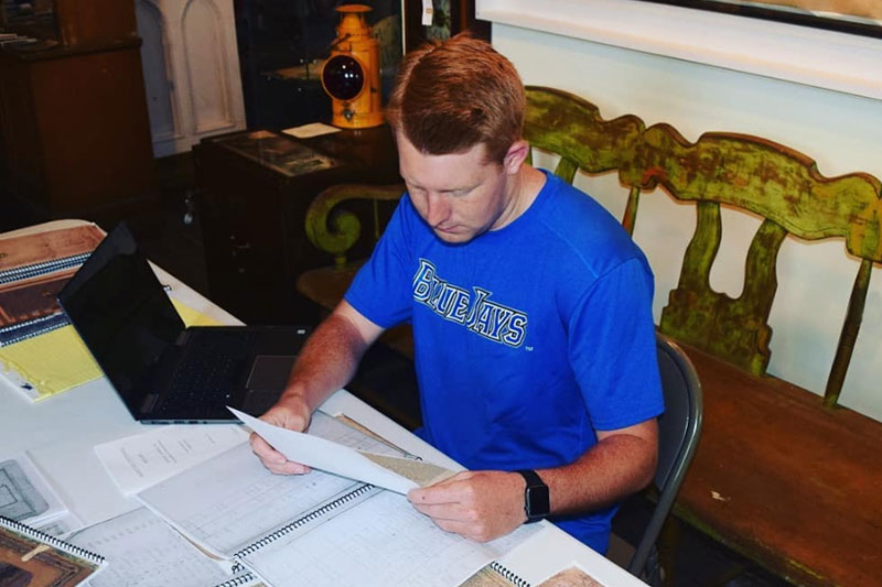 student reading in archives