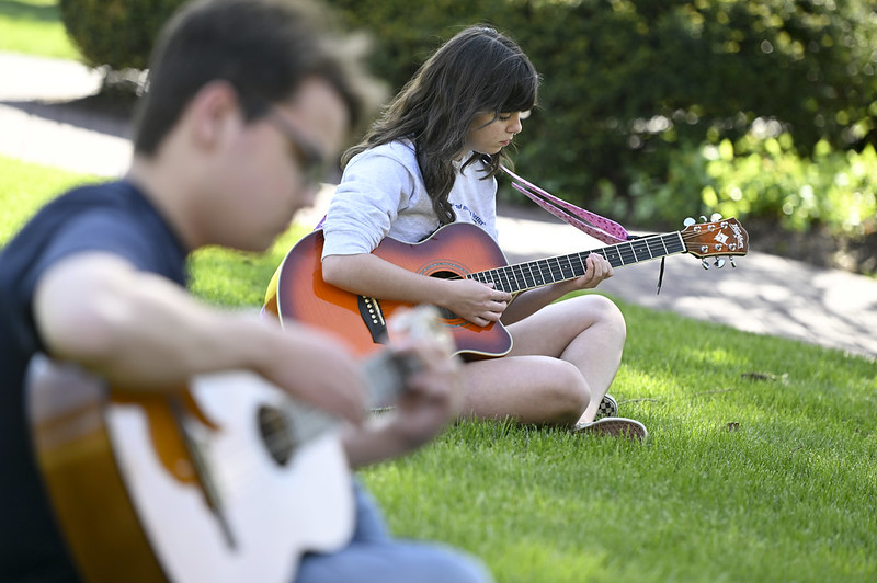 student playing guitar