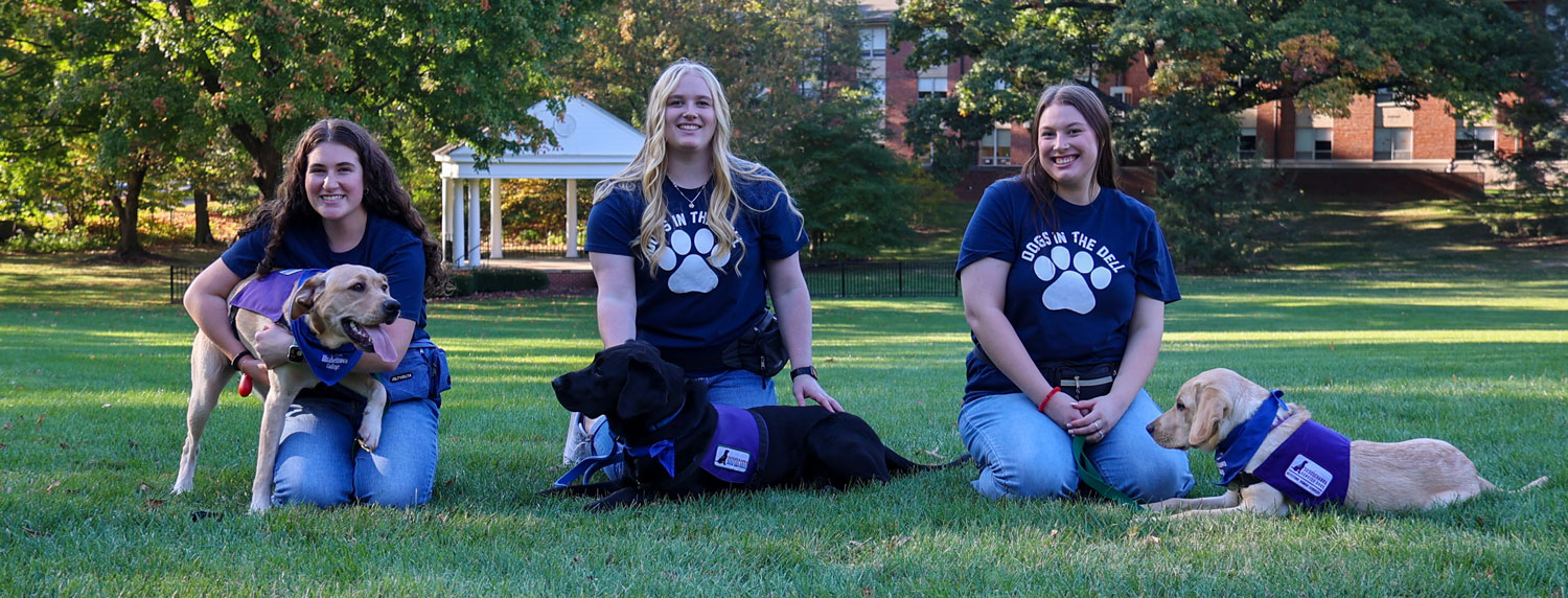 Dogs in the Dell program students