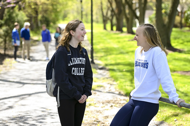 students talking outdoors