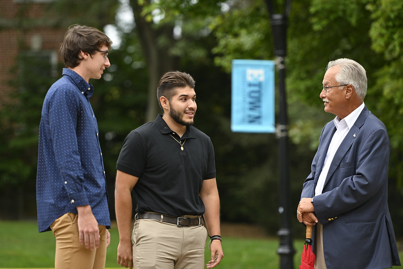 donor talking to students