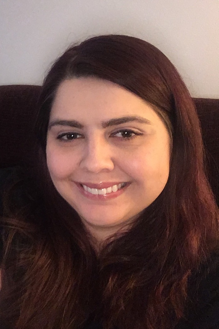 ashley is facing the camera smiling