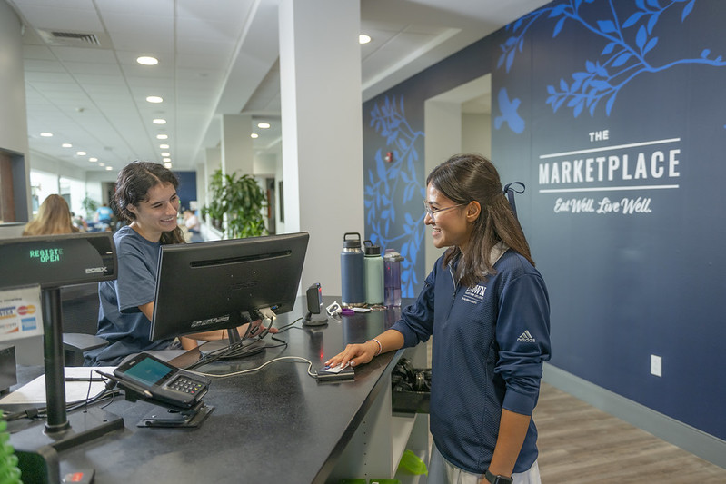 student paying for meal