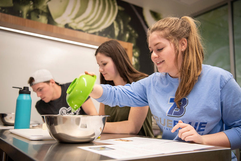 Students in kitchen cooking