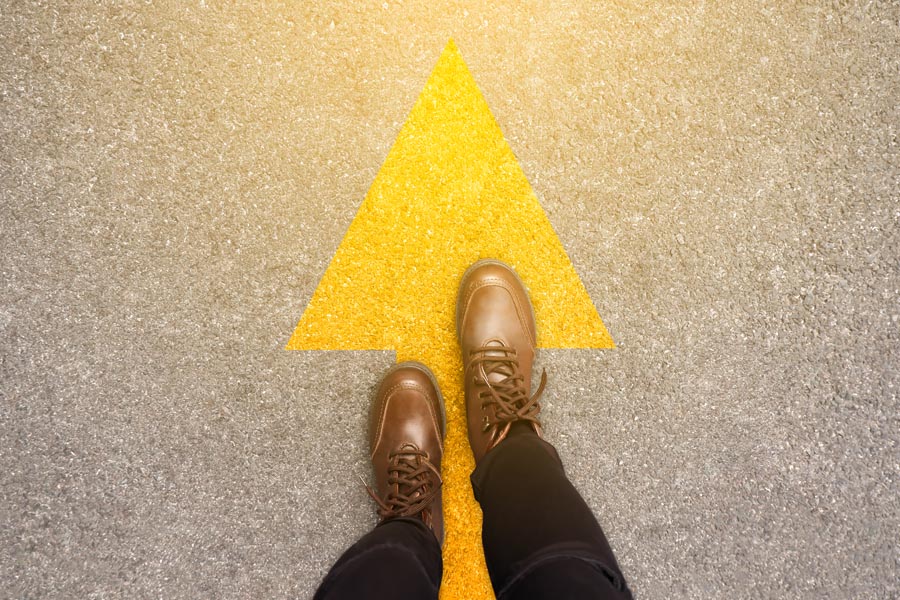 Yellow arrow with feet
